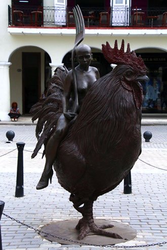 Site seeing in Havana Woman riding a rooster in Plaza Vieja